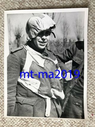 Ww2 Press Photograph - Ww2 German Pow - Medic With Red Cross Bib & Helmet Cover