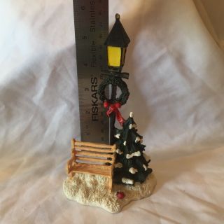 Christmas Village light post with bench,  lady bug,  wreath and tree 2