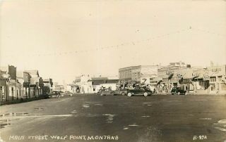 Real Photo Mt Postcard L441 Main Street Wolf Point Business District Old Cars