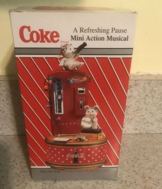 Enesco Coca - Cola A Refreshing Pause Mini Action Musical Buy The World A Coke