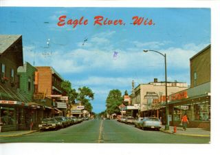 Downtown Street Scene - Stores - Old Cars - Eagle River Wisconsin - Vintage Postcard