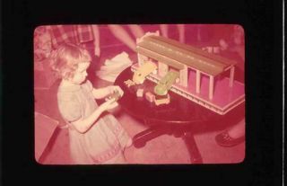 Little Girl Playing With Toy Garage / Service Station Homemade Glass Slide