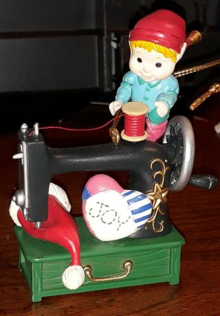 Lustre Fame Elf With A Sewing Machine With Santa 