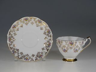 Queen Anne Fluted Floral Bouquet With Gold Chintz Tea Cup And Saucer,  England