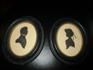 Antique Silhouettes Man And Woman In Period Oval Frames With Paper Back