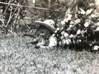 1961 Little Boy Cowboy Costume Shorting Gun In Yard Playing Behind Flowers Photo