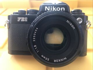 Vintage Nikon Fe2 Slr 35mm Film Camera Black Body W/ 50mm Lens