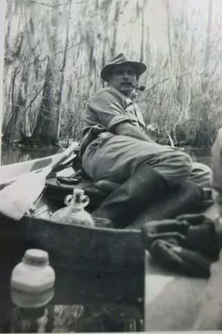 Vtg Photo 1943 Man In Row Boat W/ Tobacco Pipe & Glass Jug Moonshiner?