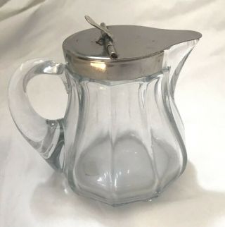 Heisey 3.  75 " Tall Clear Glass Syrup Pitcher,  Flip Top Pat 