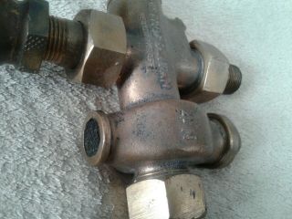 vintage antique metropolitan steam valve with 2 1/2 in valves and one main brass 2