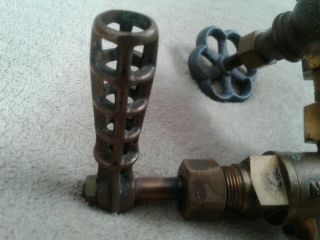 vintage antique metropolitan steam valve with 2 1/2 in valves and one main brass 3