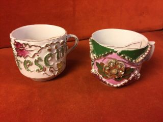 Two Antique Victorian Mustache Cup Floral Embossed