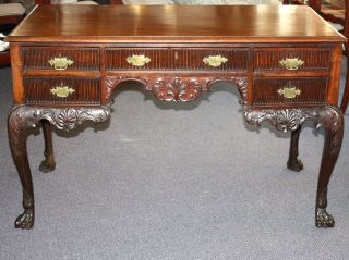 Antique Chippendale Style Hand Carved Mahogany Desk.  5 Drawers.  4 Paw Feet.  55 " W