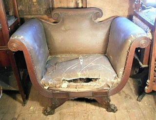 An Oversize American Empire Carved Mahogany Armchair On Claw Feet