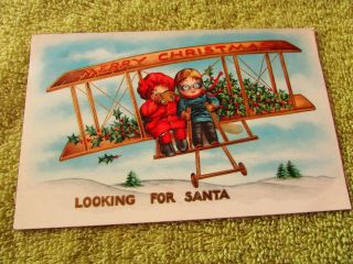Vintage Christmas Post Card Looking For Santa In A Plane
