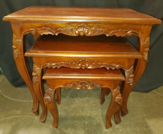Three Antique Style Carved Mahogany Nesting Tables