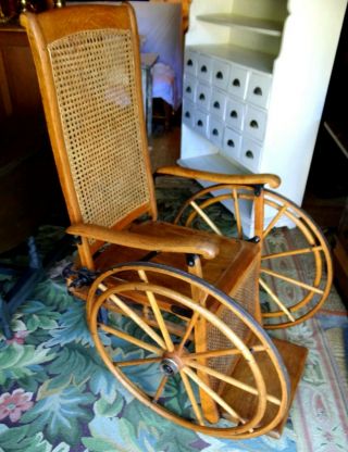 Antique Oak Wheelchair Caned back Museum quality.  LOCAL PICK UP ONLY 2