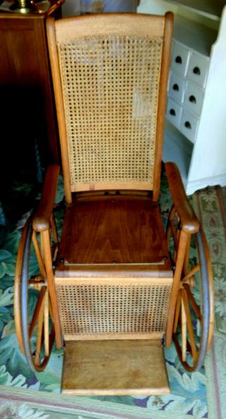 Antique Oak Wheelchair Caned back Museum quality.  LOCAL PICK UP ONLY 3