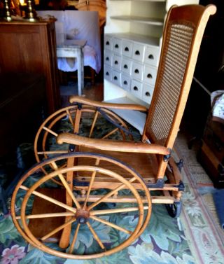 Antique Oak Wheelchair Caned back Museum quality.  LOCAL PICK UP ONLY 4