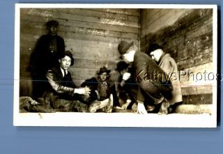 Found B&w Photo C,  9755 Men Sitting Around On Ground In Cabin