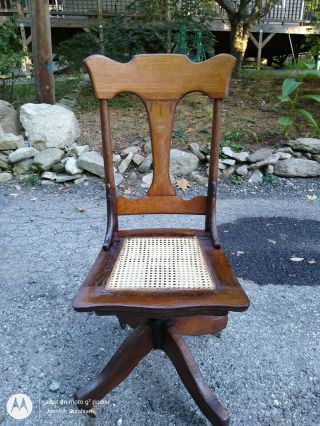 Antique Oak Swivel Rolling Desk Chair Cane Seat Seller