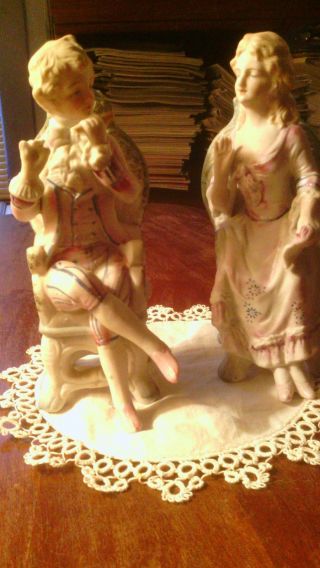 Vintage L & M Marked Bisque Figurines Lady And Man On Chairs 6 3/4 H