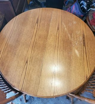 OAK CLAW FOOT ROUND TABLE WITH LEAF AND 6 PATTERNED BACK WOOD CHAIRS 2