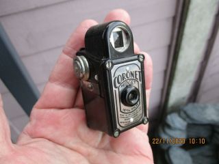 A Vintage Black Bakelite Coronet Midget Camera With Film Inside