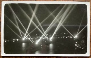 Vintage Night Time Rppc View Of Naval Ships With Searchlights On Malta Harbour