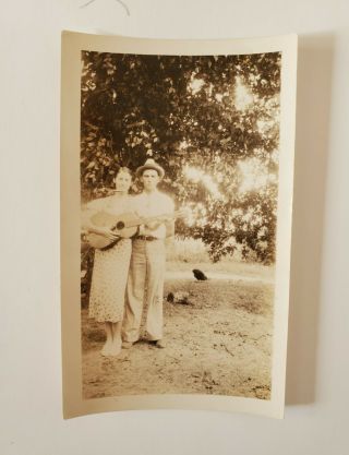Vintage Photograph Man With Woman Holding Guitar And Harmonica Early 1900 