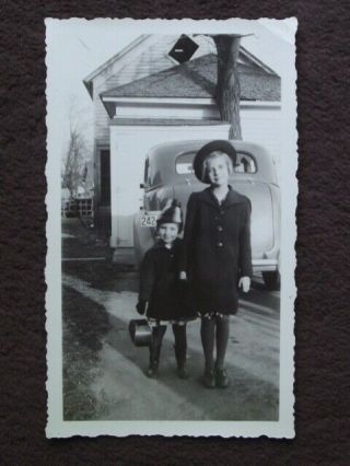 Two Cute Young Girls Standing In Front Of The Back Of The Car 1938 Photo