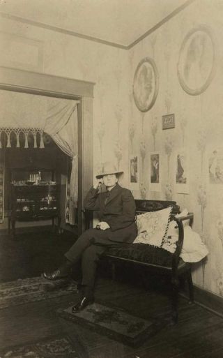 Vintage Rppc Interior Photograph Woman Dressed As Man? Sitting On Settee 1910s