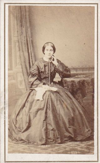 Antique Cdv Photo - Seated Lady At Table.  Long Full Dress.  No Studio
