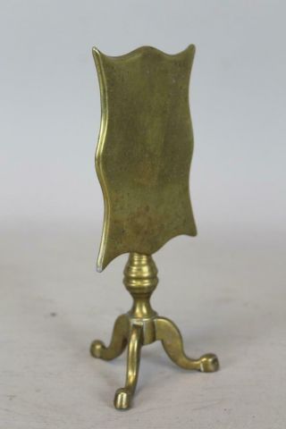 A RARE LATE 18TH C BRASS CANDLE REFLECTOR IN THE SHAPE OF A TILT TOP TEA TABLE 3