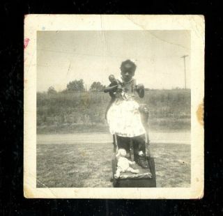 Vintage Photo African American Girl In Leg Braces Plays With Black & White Dolls