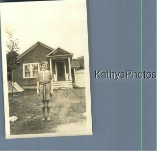 Found B&w Photo K_8110 Girl Standing In Front Of Cute Little House