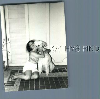 Found B&w Photo A,  0500 Woman Sitting On Floor Hugging Dog