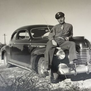 Vintage 1947 Black And White Photo Man Sitting On Buick Roadmaster Classic Car