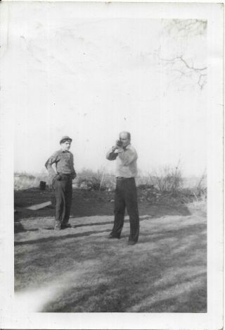 Vintage Photo Man In Bolo Hat Watches Man Pointing Gun At Camera