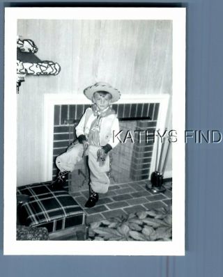 Found B&w Photo H,  6999 Little Cowboy Posed By Fireplace Holding Pistols