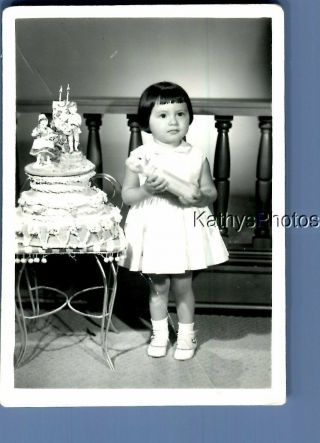 Found B&w Photo F,  5582 Little Girl In Dress Posed By Cake
