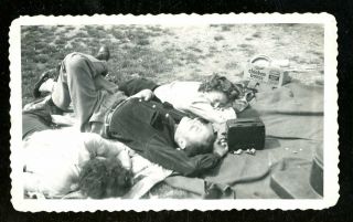 Vintage Photo Couple Listens To Radio While Laying On Blanket Picnic In Woods