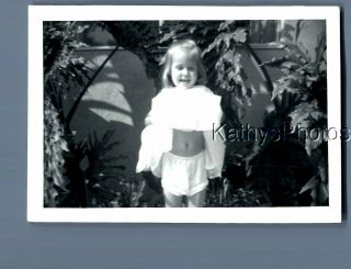 Found B&w Photo F,  6304 Little Girl In Dress Posed By Plants