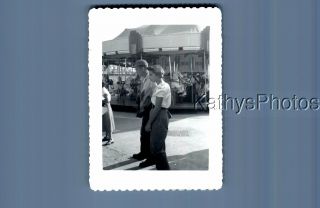 Found B&w Photo F,  6942 Man And Woman From Side By Carousel