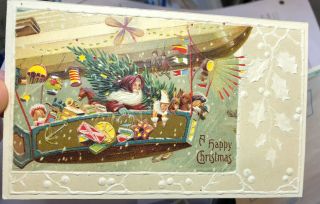 Santa Claus Hold To Light Postcard Christmas Zeppelin Flying Dirigible Rare
