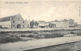 H25/ Columbus Montana Postcard C1910 Pike Avenue Saloon Church Stores