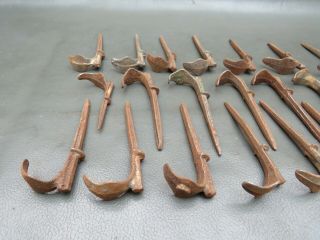 22 small antique cast iron brackets hooks pipe or wire supports 2