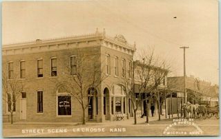 1910s La Crosse,  Kansas Rppc Photo Postcard " Street Scene " Real Estate Office