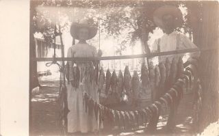 H43/ Interesting Rppc Postcard C1910 Fishing Catch Hanging Woman Pole 12