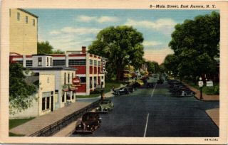 Postcard Ny East Aurora Main Street Classic Cars Coca Cola Sign Linen 1940 M24
